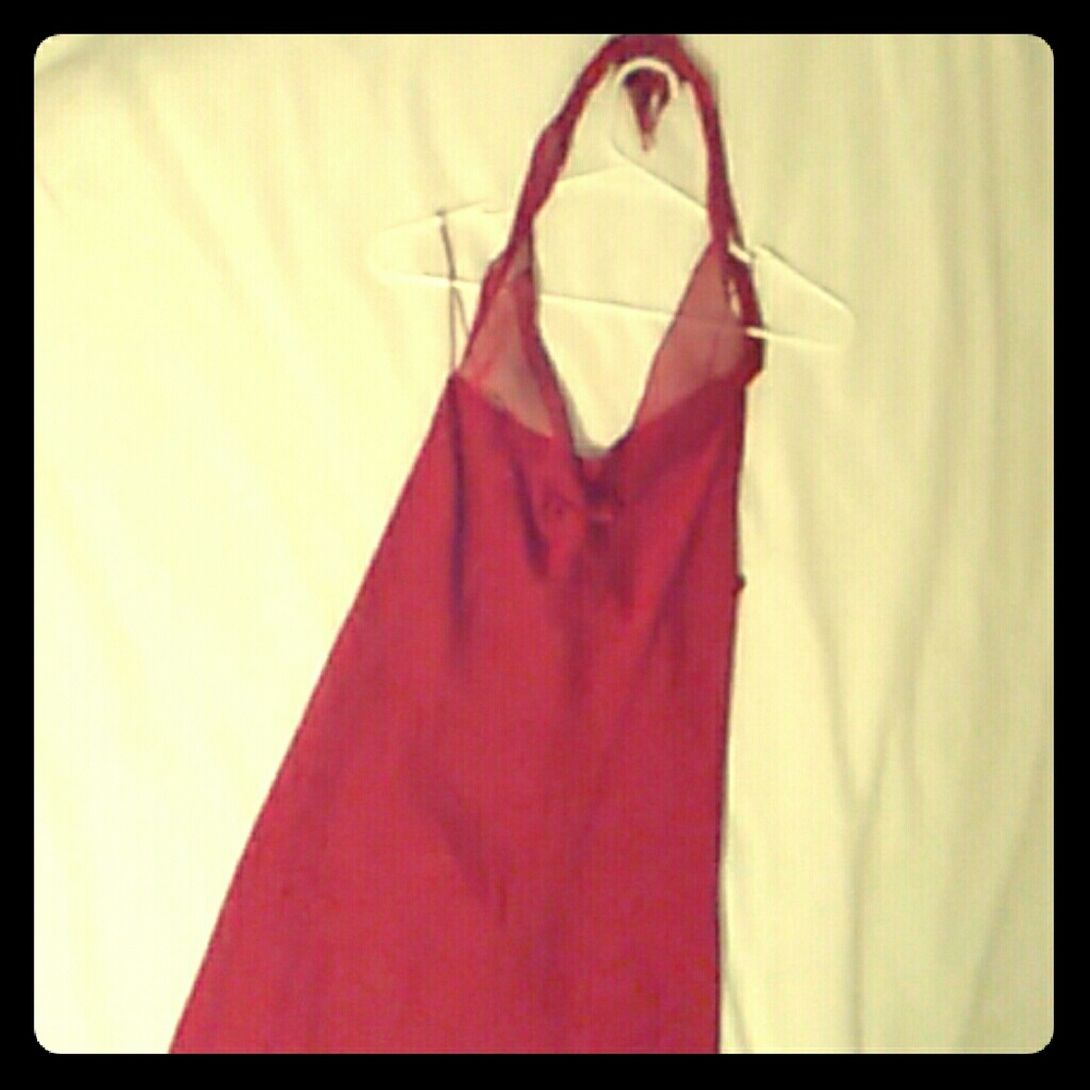 Dark red, flowy, large, formal dress.